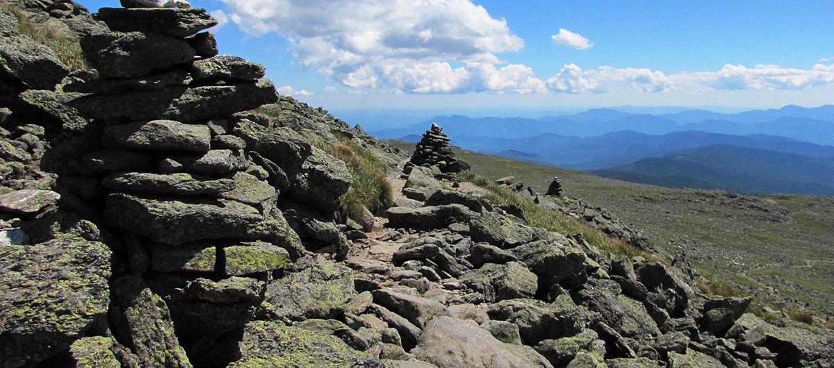 Stone cairns along a mountain summit trail
